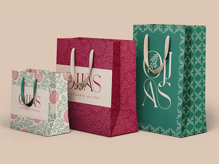 Three paper bags of Ojjas Company featuring Avval Digital Marketing's packaging design