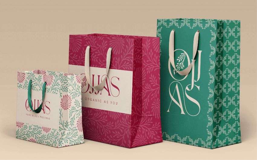 Three shopping bag with green and Red floral print, designed by Avval Digital Marketing Company for Ojjas brand