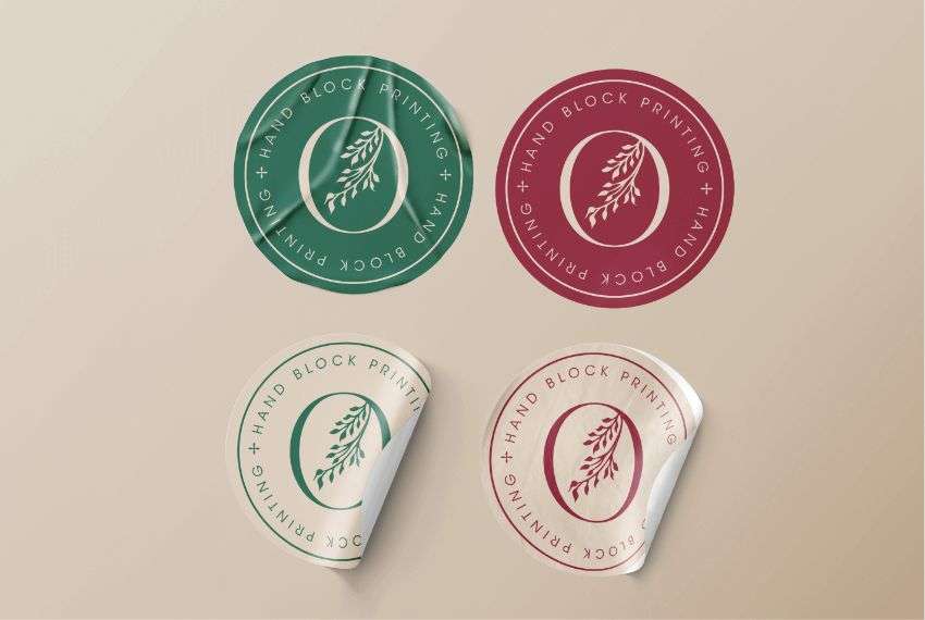 A circular sticker with green and pink floral print, designed by Avval Digital Marketing Company for Ojjas brand