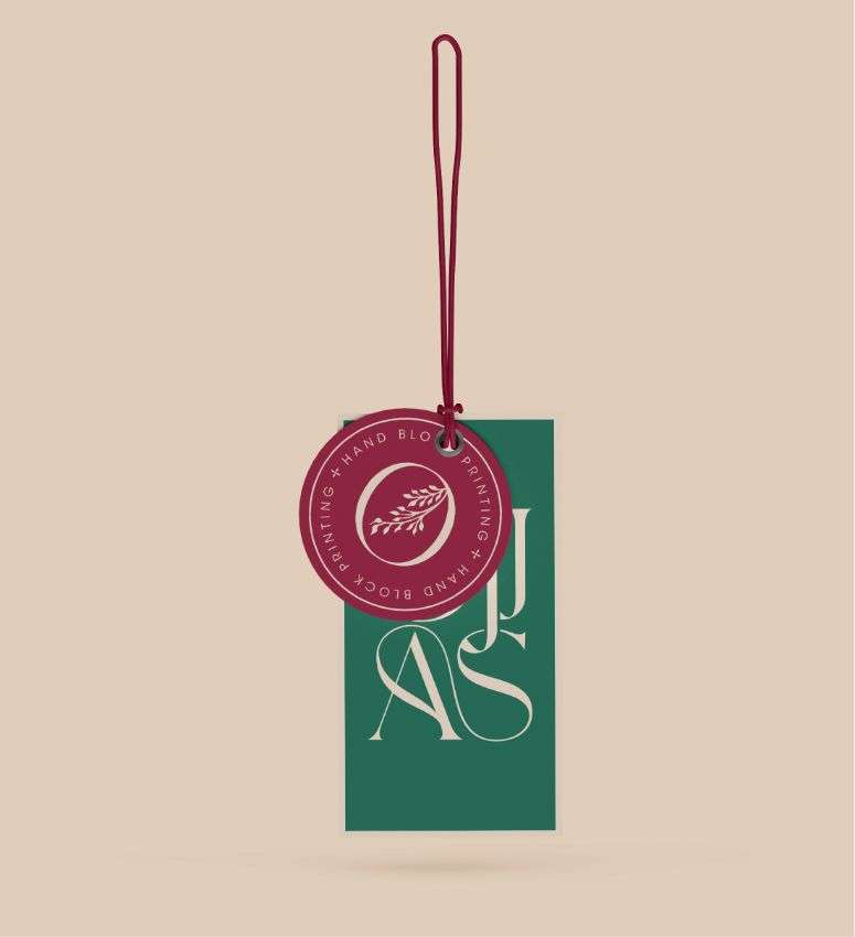 A rectangular swing tag with green and pink floral print, designed by Avval Digital Marketing Company for Ojjas brand