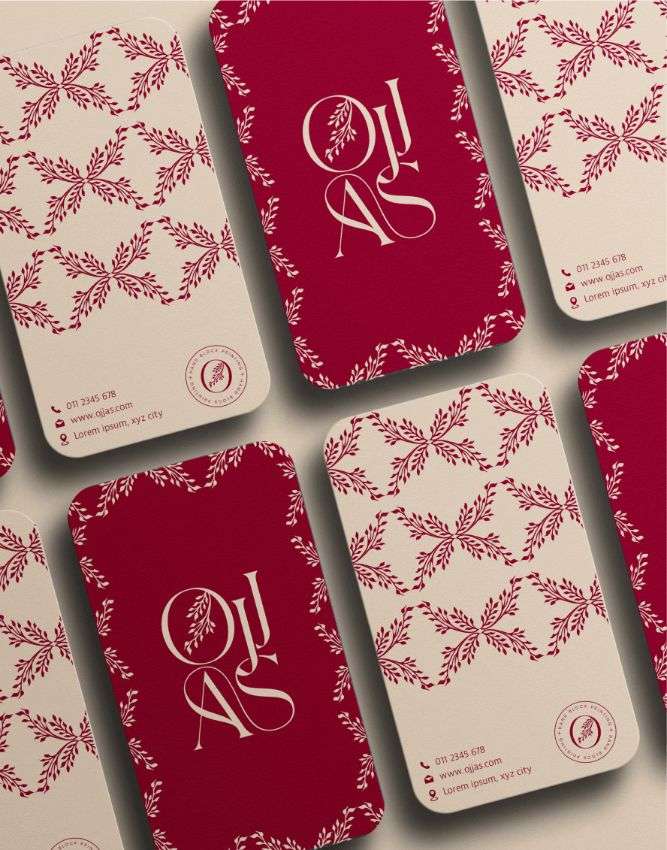 A rectangular business card with red and cream floral print, designed by Avval Digital Marketing Company for Ojjas brand