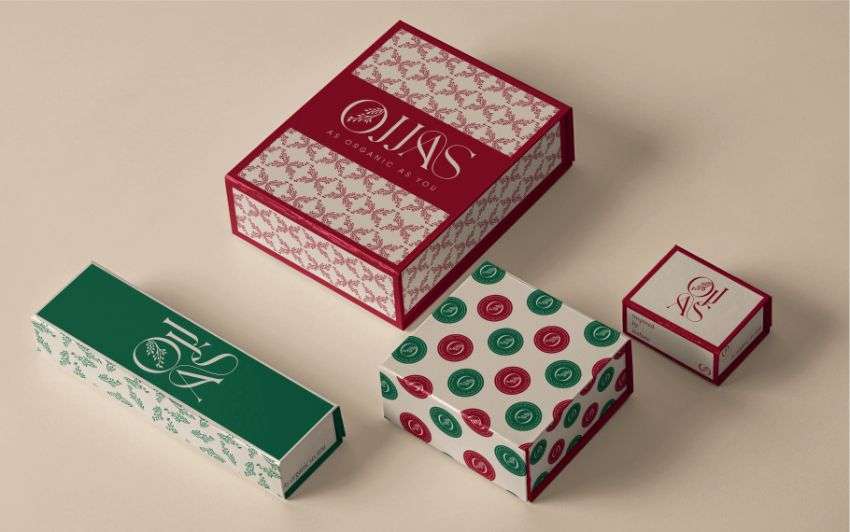 cardboard boxes with green and red floral print, designed by Avval Digital Marketing Company for Ojjas brand