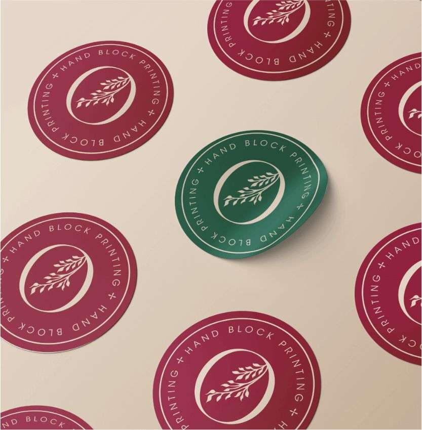 A circular sticker with green and pink floral print, designed by Avval Digital Marketing Company for Ojjas brand